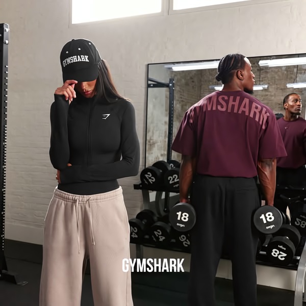 gym wear, athletic clothing, workout clothes, sweatpants, long sleeve shirt, sportswear, brand awareness, lifestyle, energetic, trustworthy, neutral, black